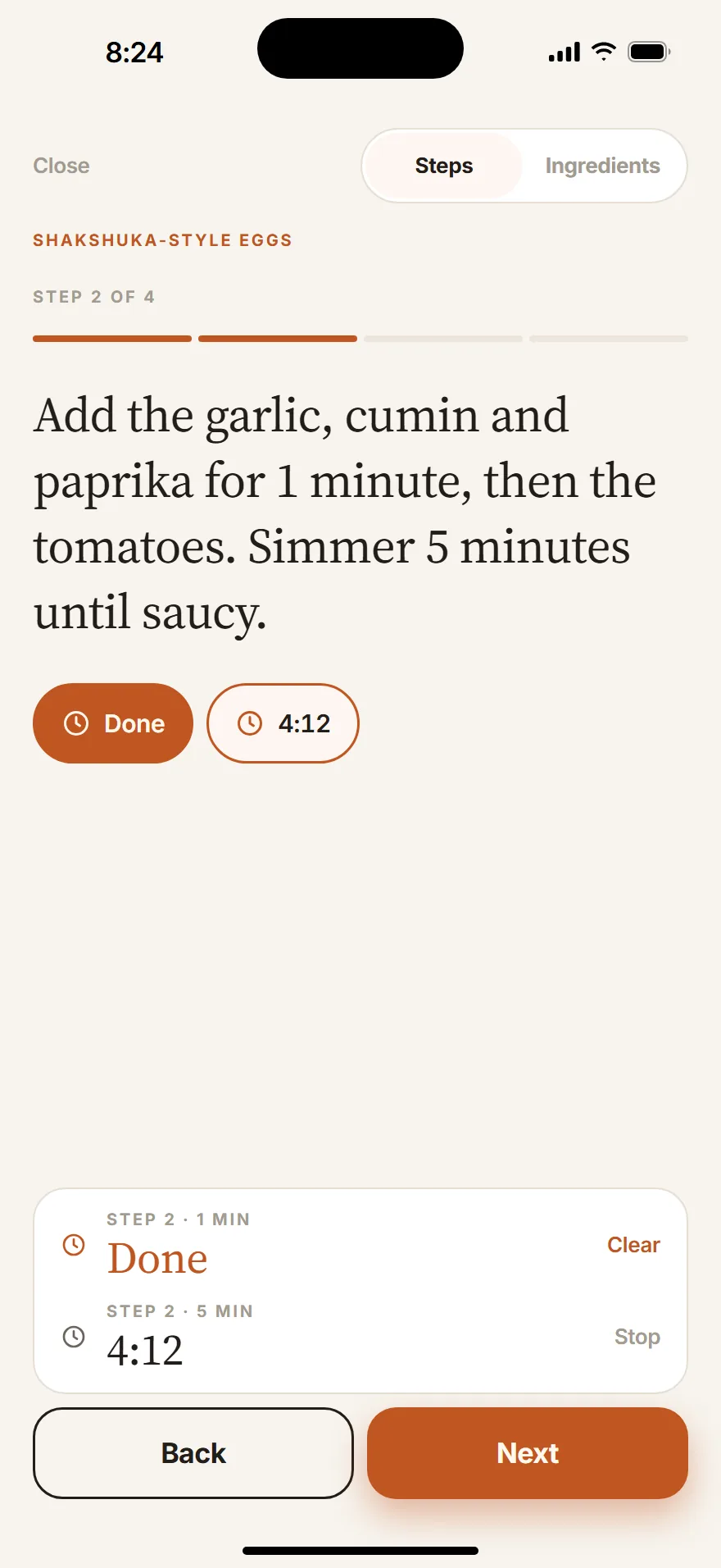 Cook mode on step 2 of shakshuka: a finished 1 minute timer and a 5 minute timer counting down at 4:12.